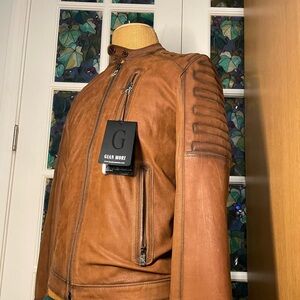 The leather jacket was never worn, in perfect condition universal 4 men & women!